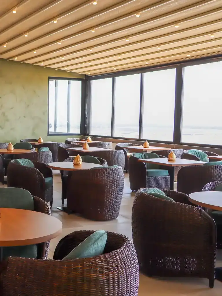Mishkat woven chairs and wooden tables